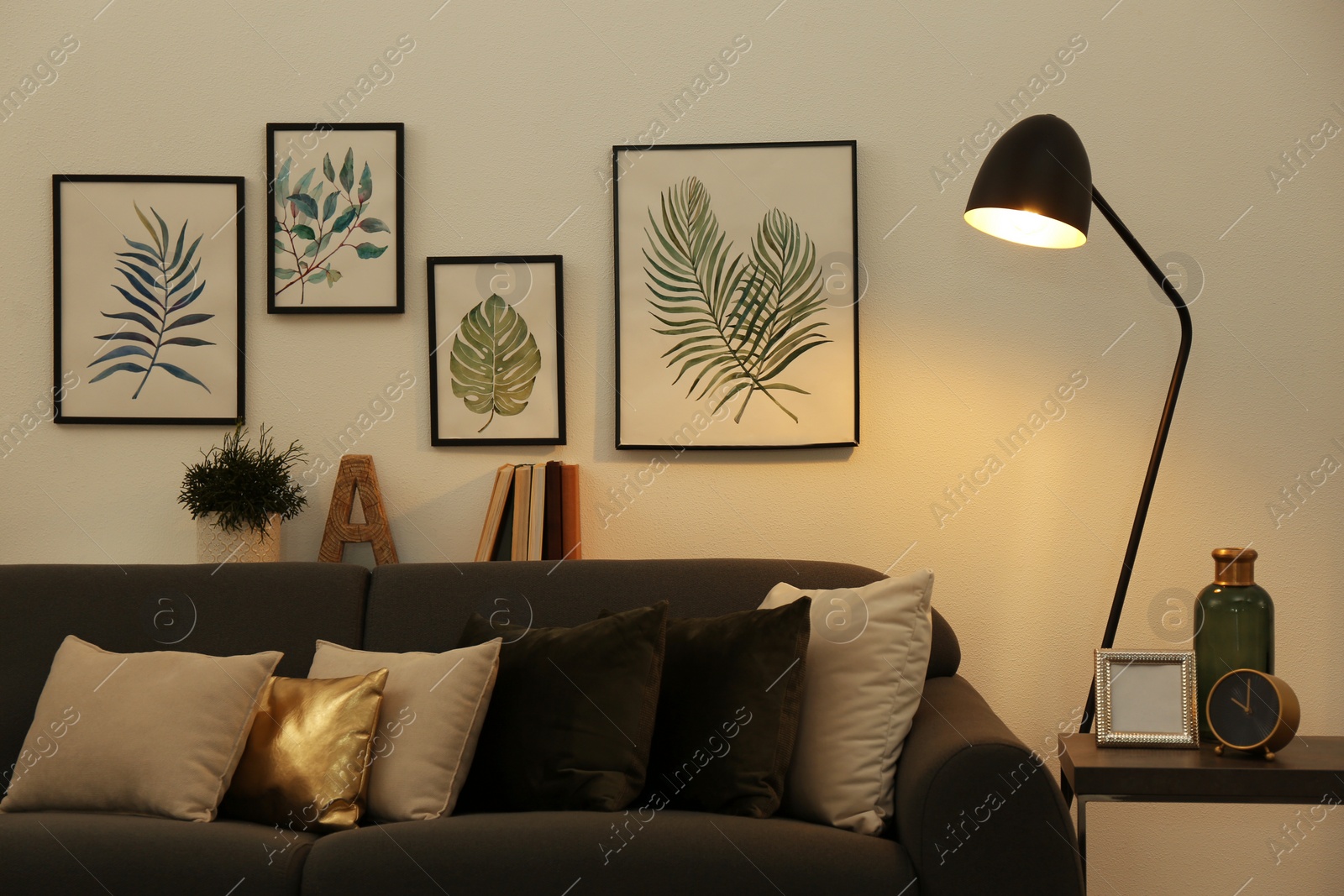 Photo of Stylish living room interior with comfortable sofa and floor lamp