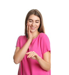 Happy young woman wearing beautiful engagement ring on white background