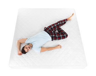 Young man sleeping on mattress against white background, above view