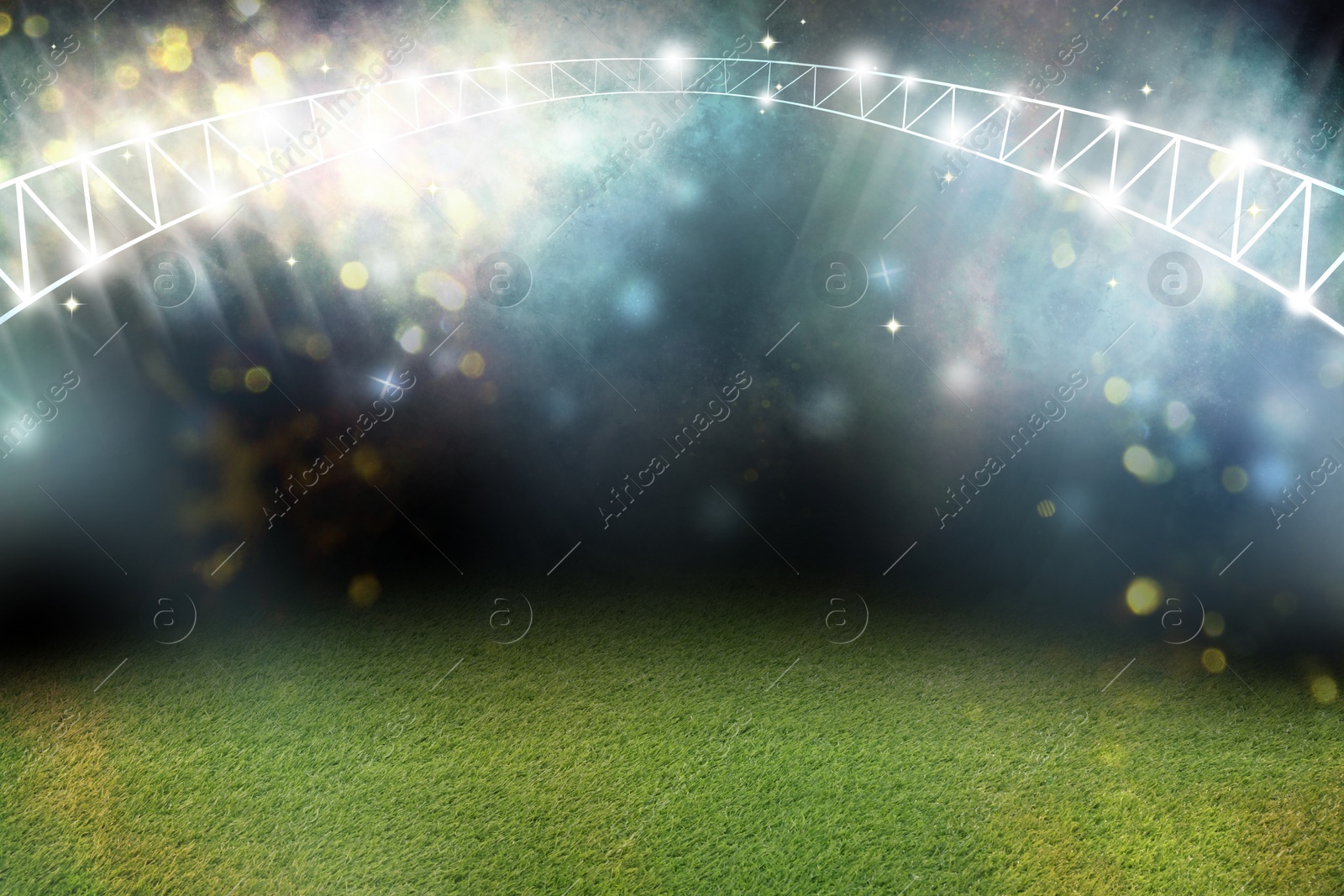 Image of Green sports field under stadium lights, bokeh effect