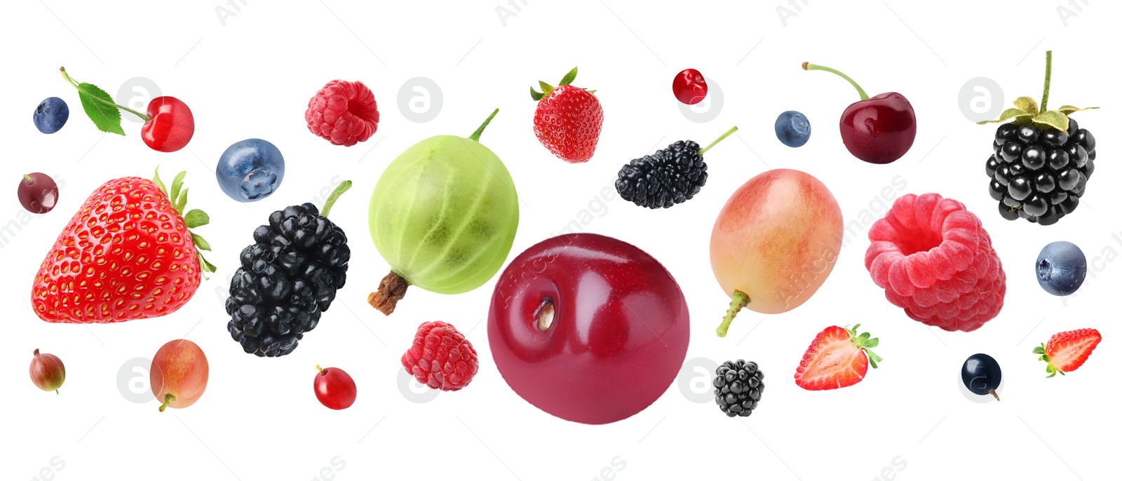 Image of Many different fresh berries falling on white background