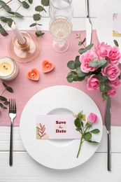 Photo of Romantic table setting with flowers and candles, flat lay