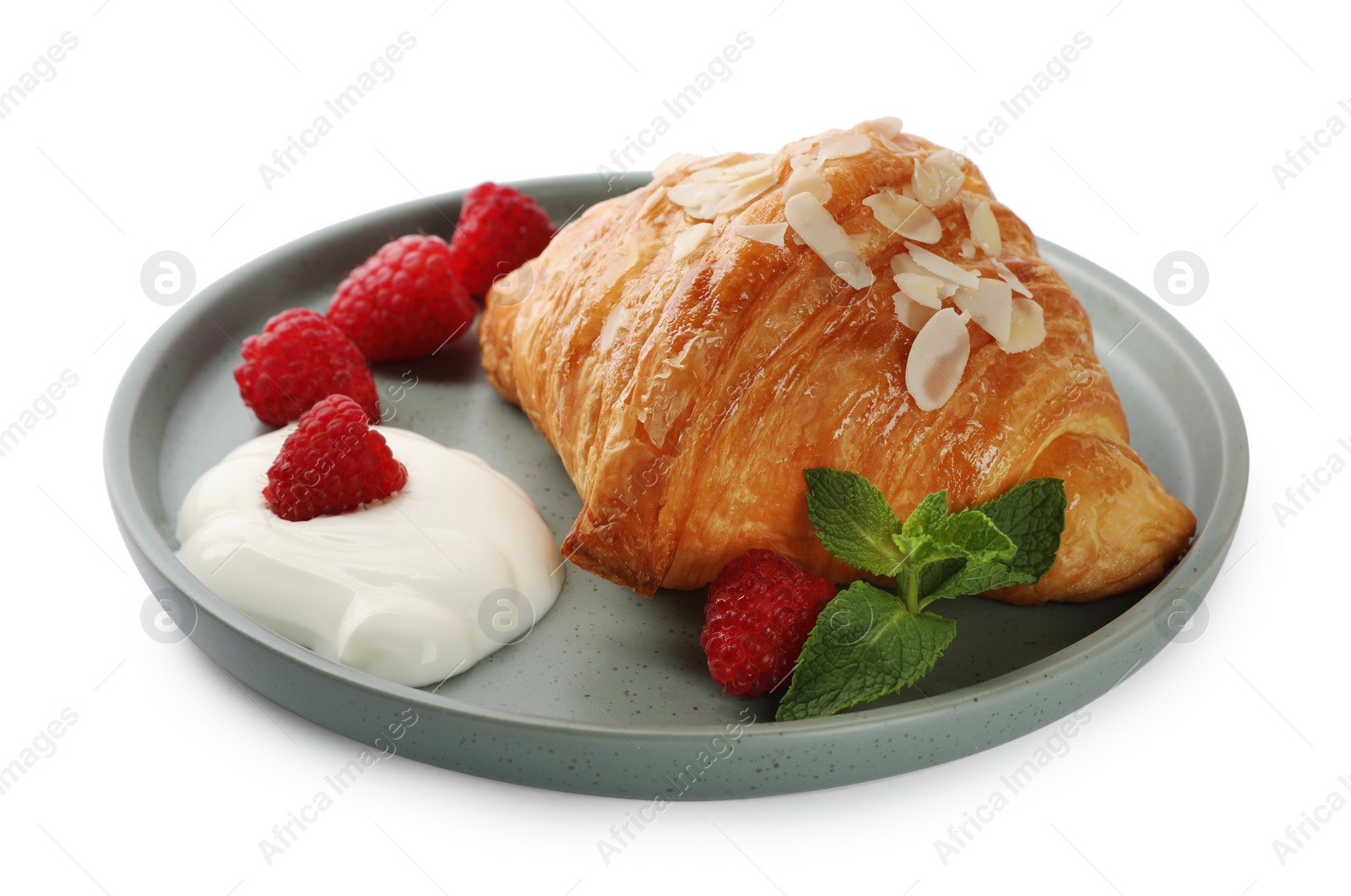 Photo of Delicious croissant, cream cheese and raspberries isolated on white