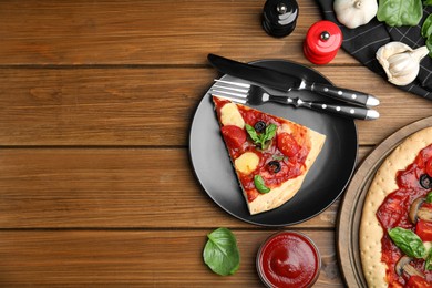 Photo of Slice of delicious pita pizza and ingredients on wooden table, flat lay. Space for text