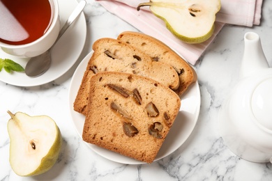 Photo of Flat lay composition with pear bread on white marble table. Homemade cake