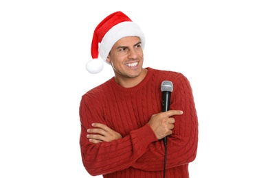 Photo of Happy man in Santa Claus hat with microphone on white background. Christmas music