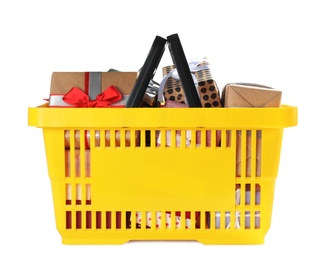 Photo of Shopping basket full of gift boxes on white background