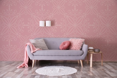 Image of Modern room interior with sofa near patterned wallpapers