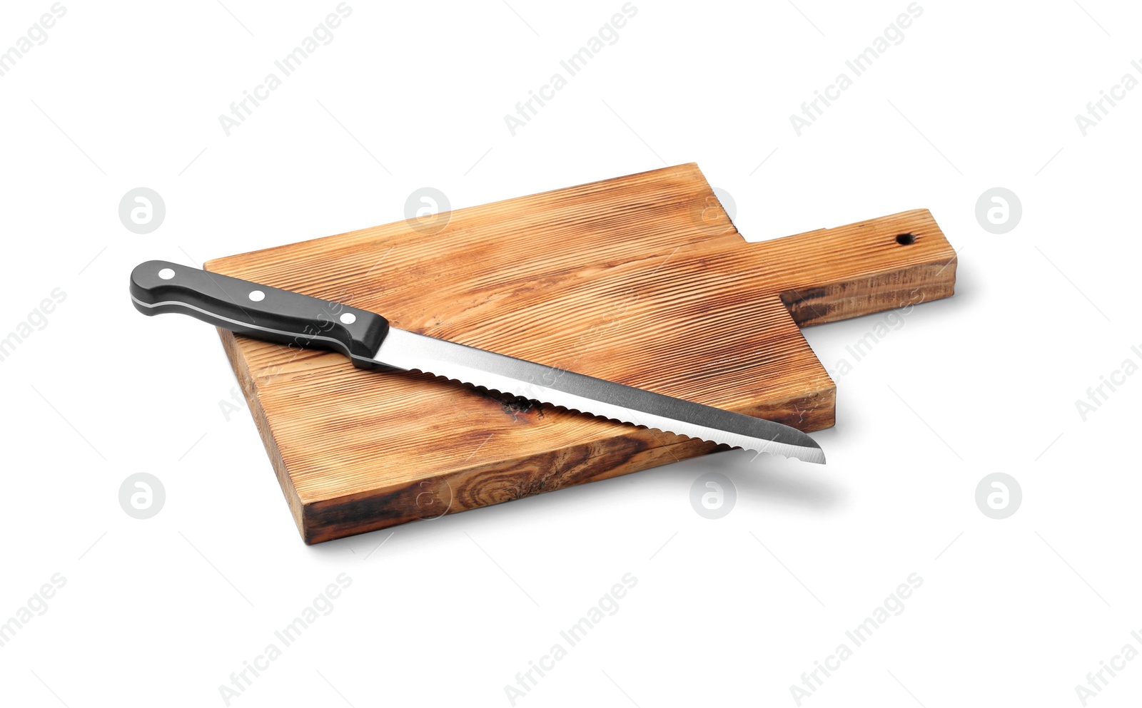 Photo of Stainless steel bread knife with plastic handle on board against white background
