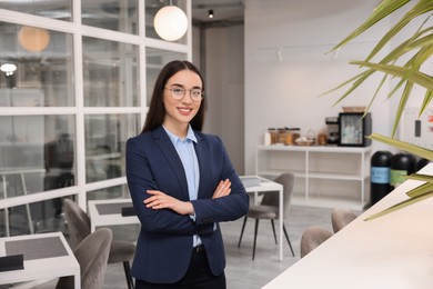 Female real estate agent indoors. Space for text