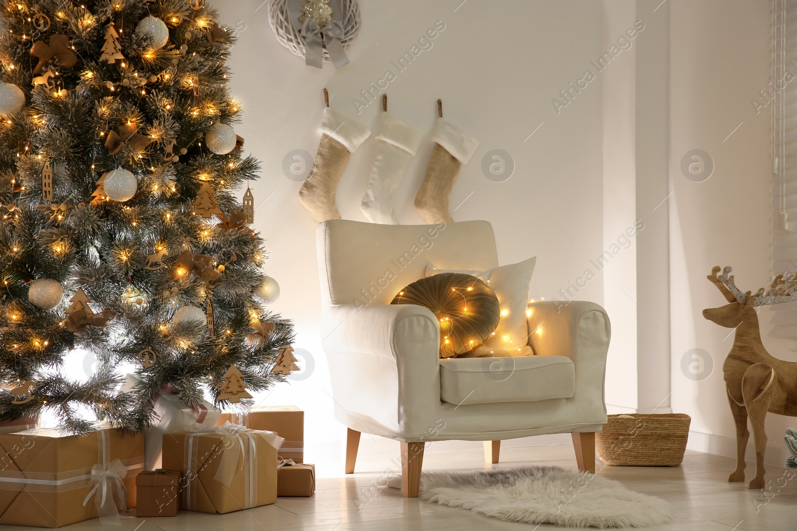 Photo of Beautiful decorated Christmas tree in festive room interior