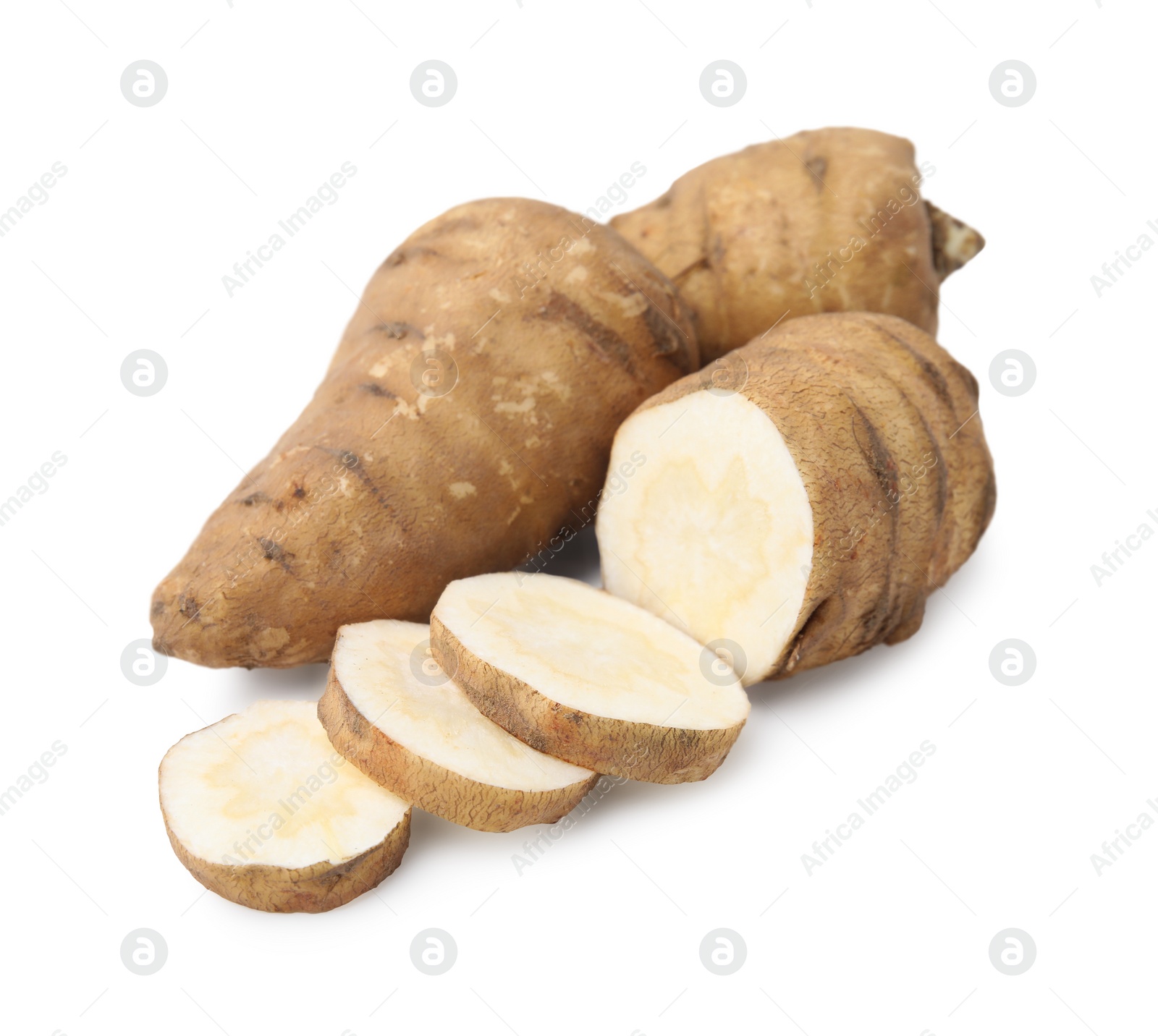 Photo of Whole and cut turnip rooted chervil tubers isolated on white