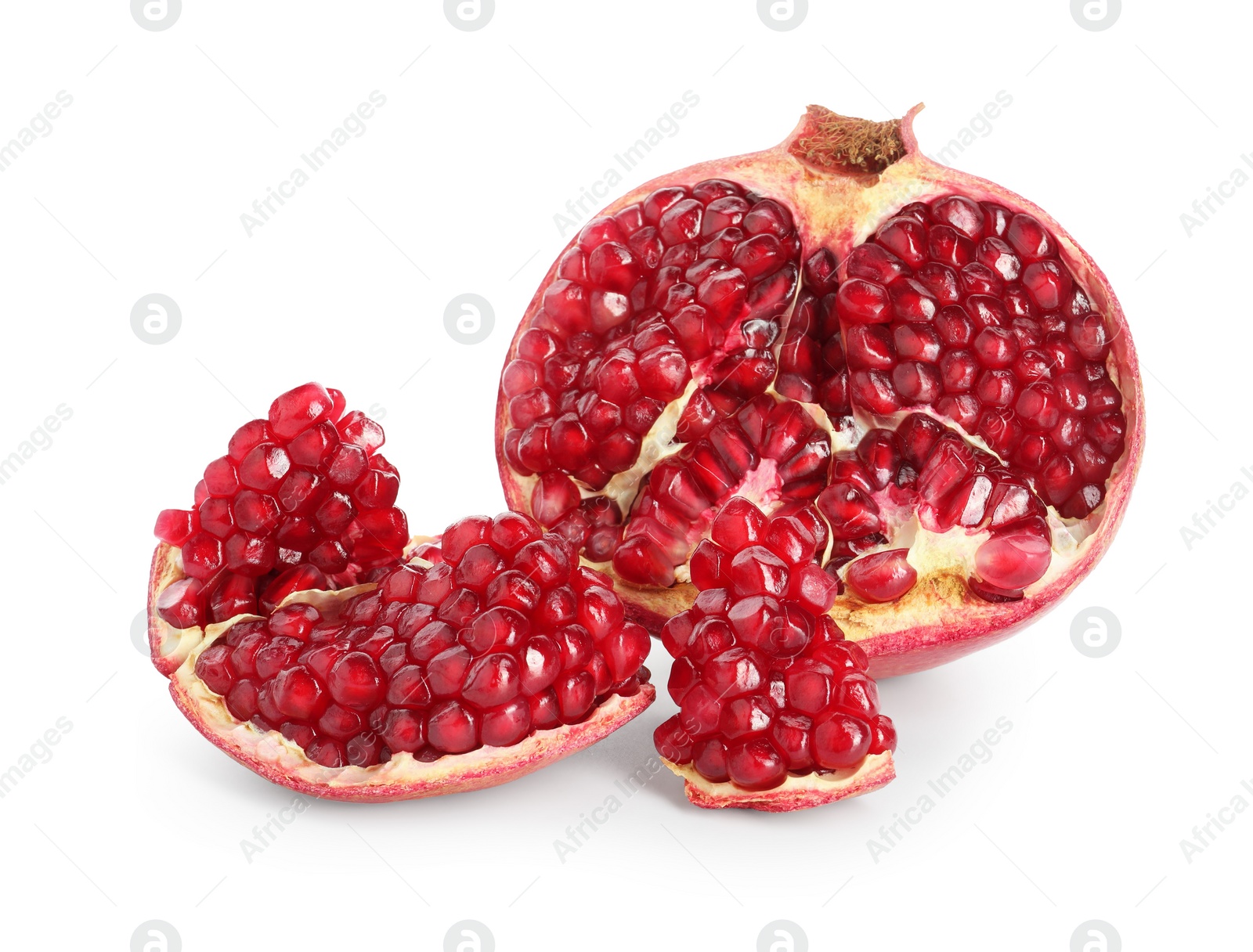 Photo of Fresh cut pomegranate with juicy seeds isolated on white