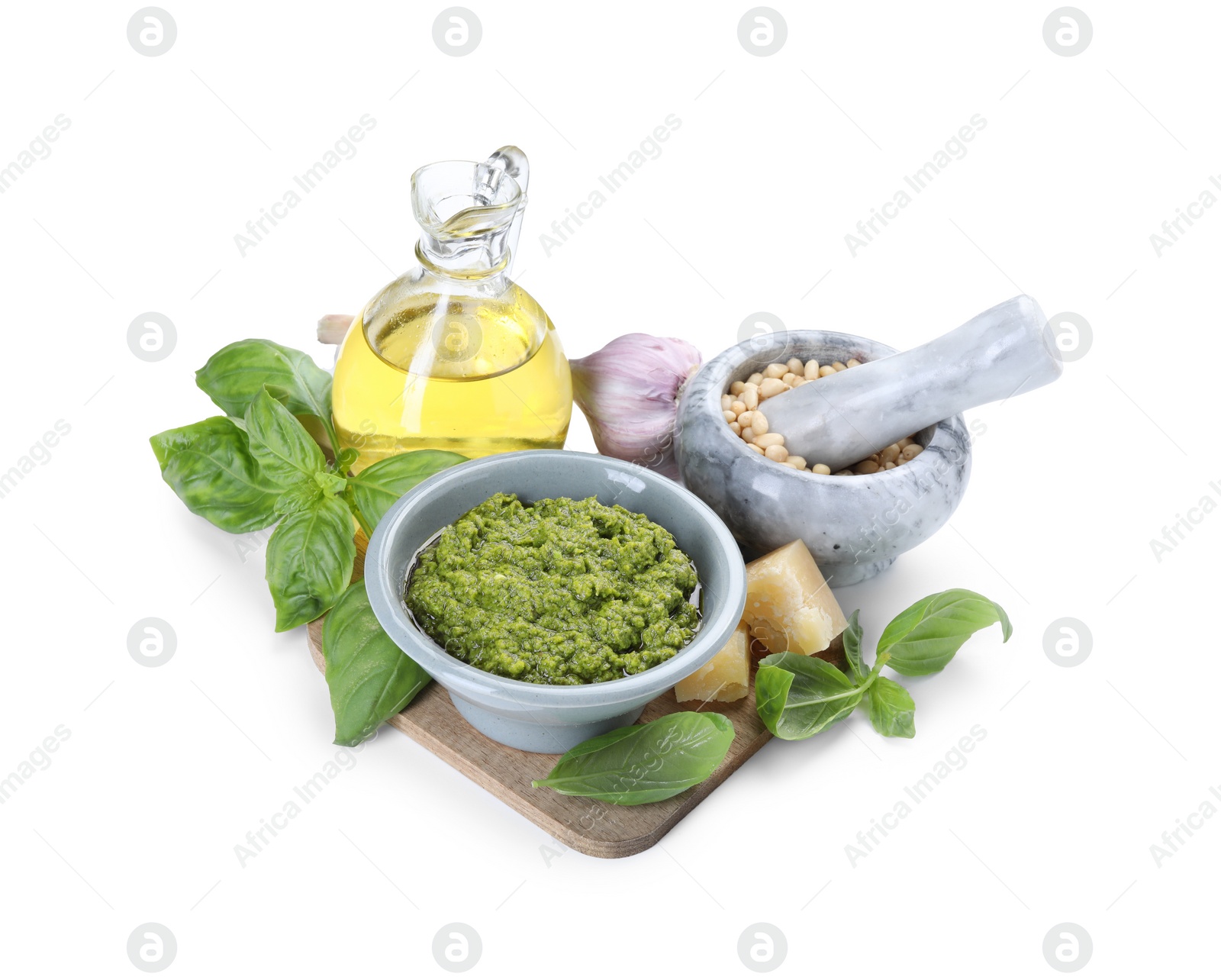 Photo of Fresh tasty pesto sauce and ingredients isolated on white