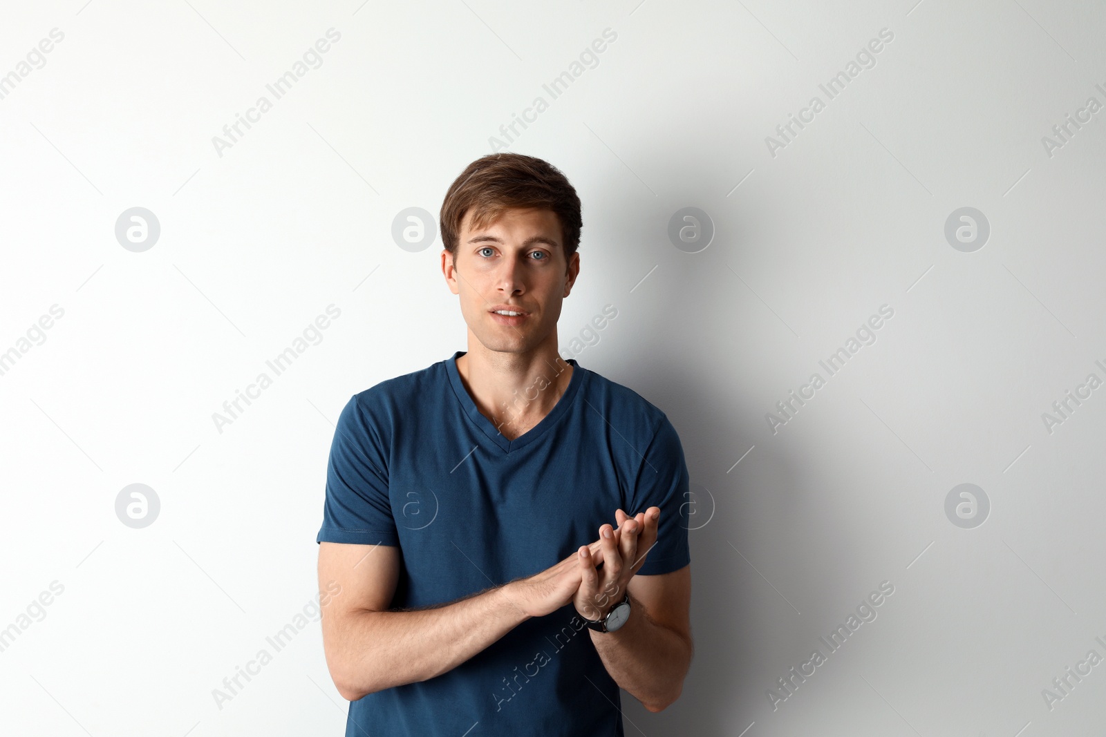 Photo of Portrait of handsome man on light background