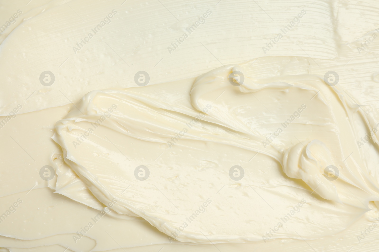 Photo of Texture of tasty butter as background, top view