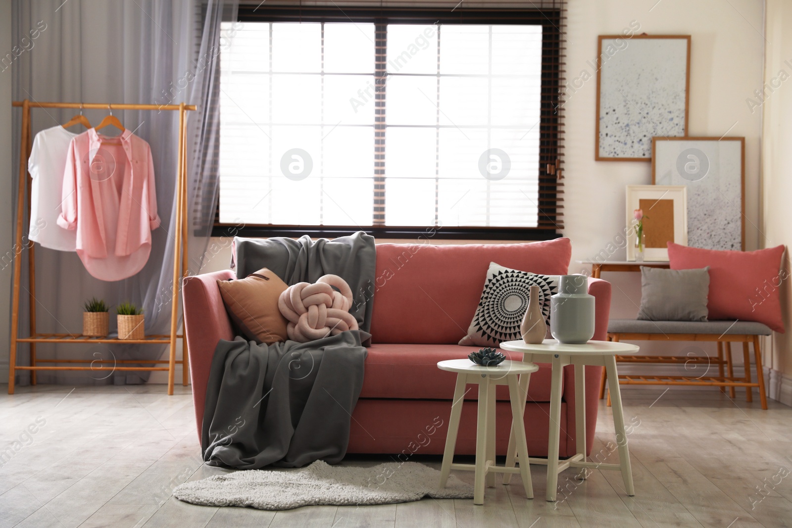 Photo of Interior of cozy living room with comfortable sofa