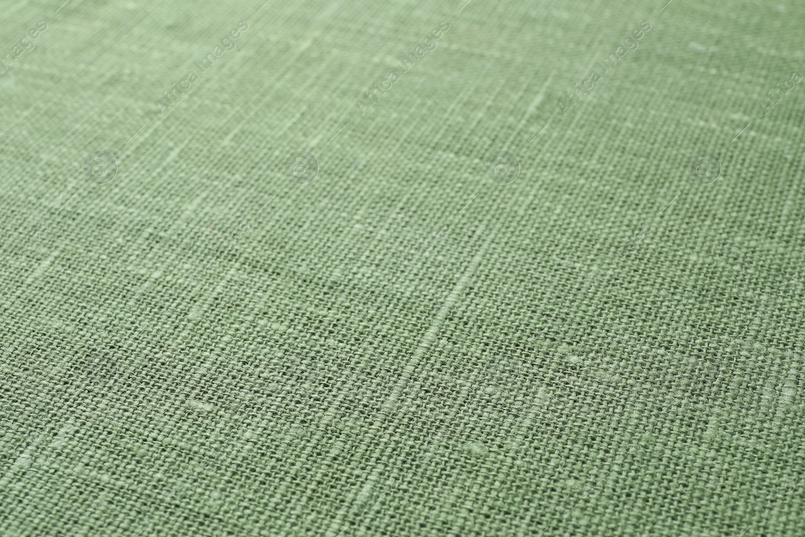Photo of Texture of green fabric as background, closeup