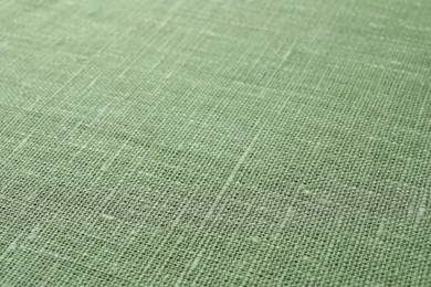 Texture of green fabric as background, closeup