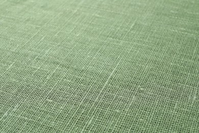 Photo of Texture of green fabric as background, closeup