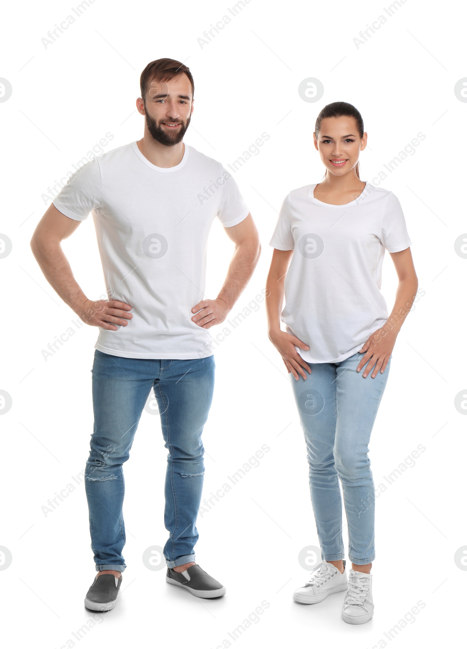 Photo of Young couple in t-shirts on white background. Mockup for design