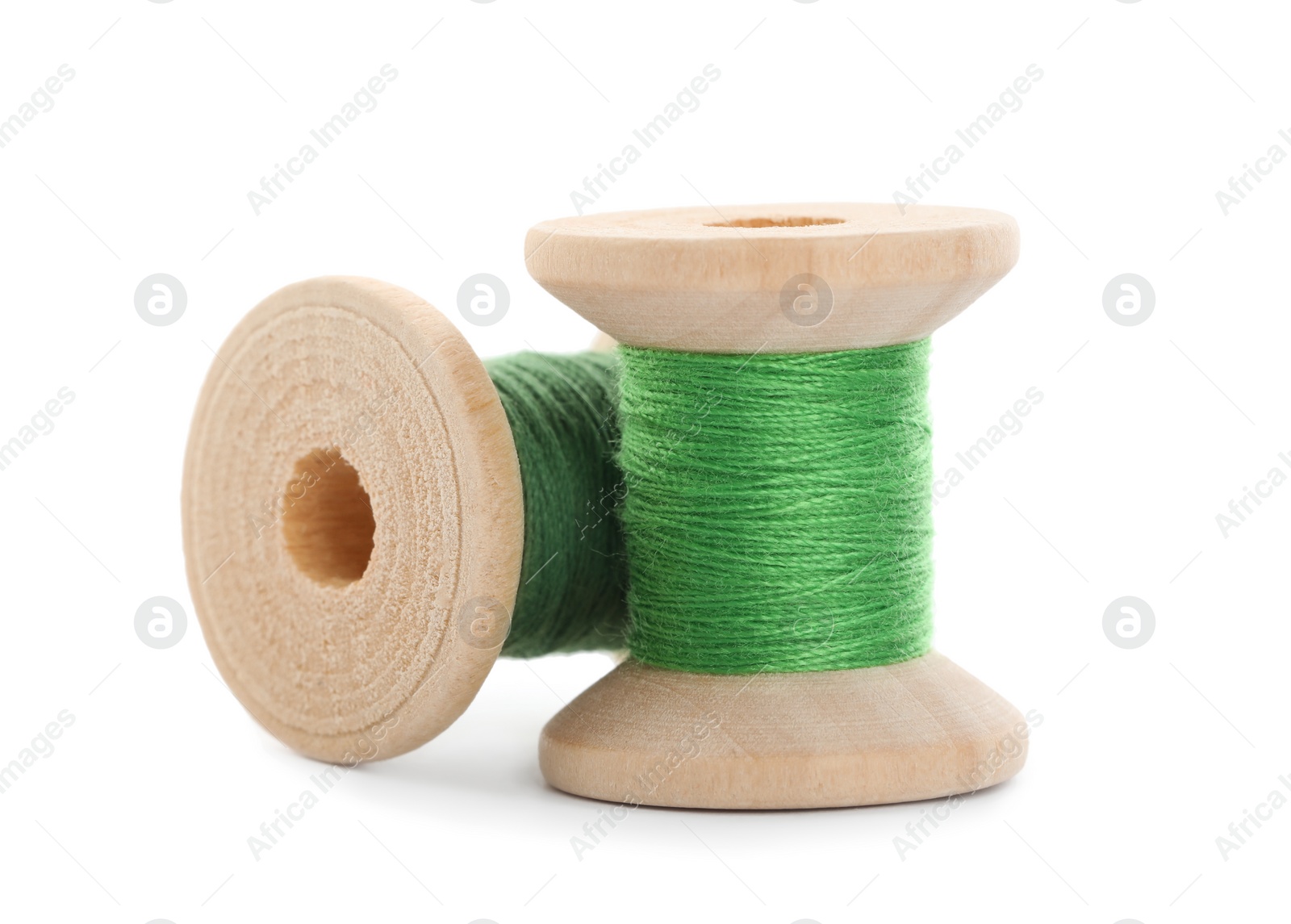 Photo of Different colorful sewing threads on white background