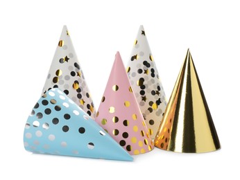 Bright party hats on white background. Festive accessory