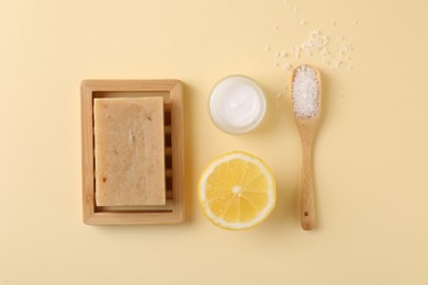 Photo of Flat lay composition with jar of cream on beige background. Body care product