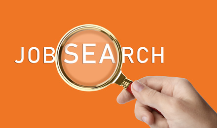 Image of Woman holding magnifying glass on orange background, closeup. Job search