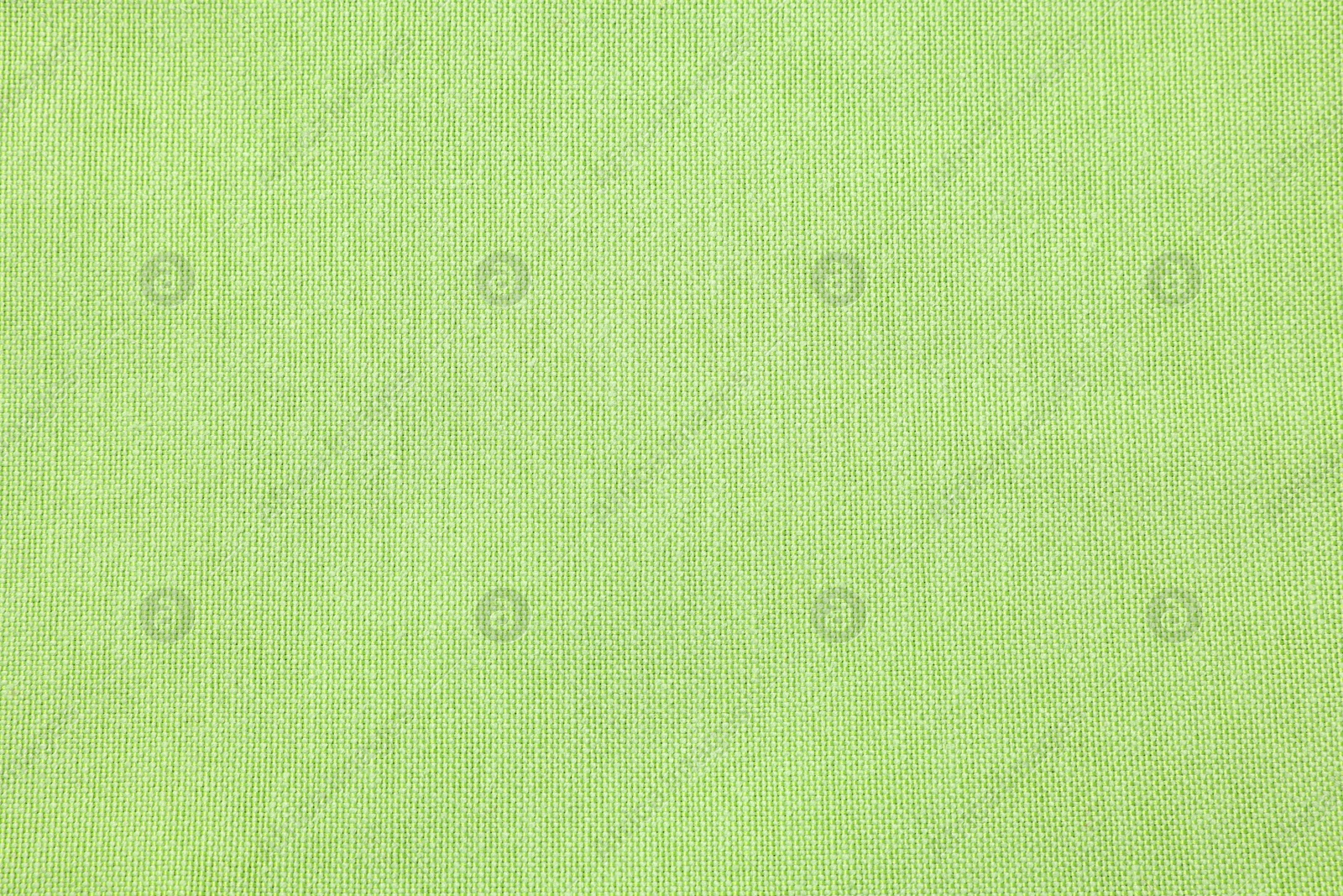 Photo of Texture of light green fabric as background, top view