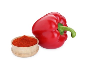 Photo of Bowl with aromatic paprika powder and fresh bell pepper isolated on white