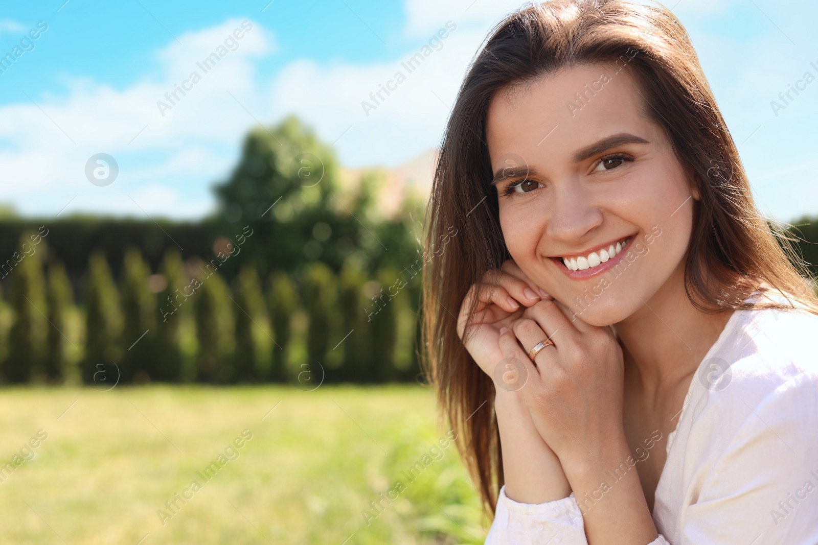 Photo of Portrait of beautiful young woman at backyard, space for text