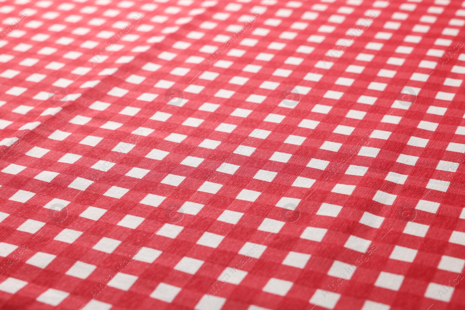 Photo of Red checkered tablecloth as background, closeup view