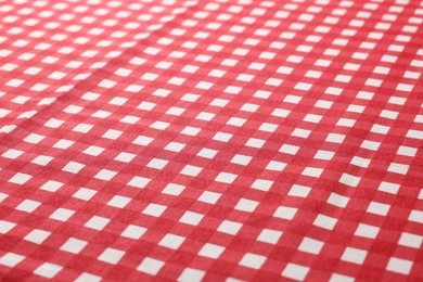 Photo of Red checkered tablecloth as background, closeup view