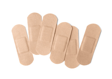 Photo of Medical sticking plasters isolated on white. First aid item