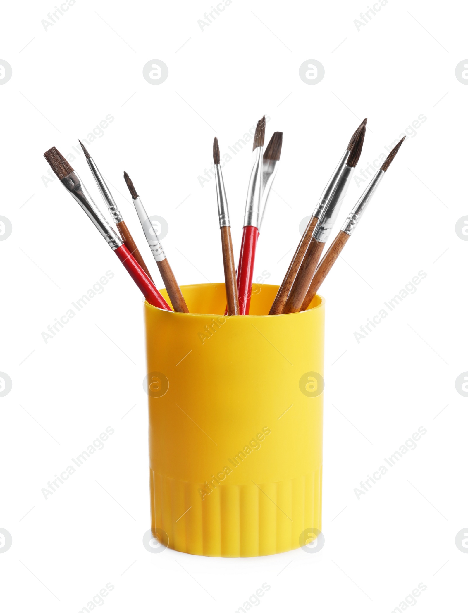 Photo of Holder with different paint brushes on white background