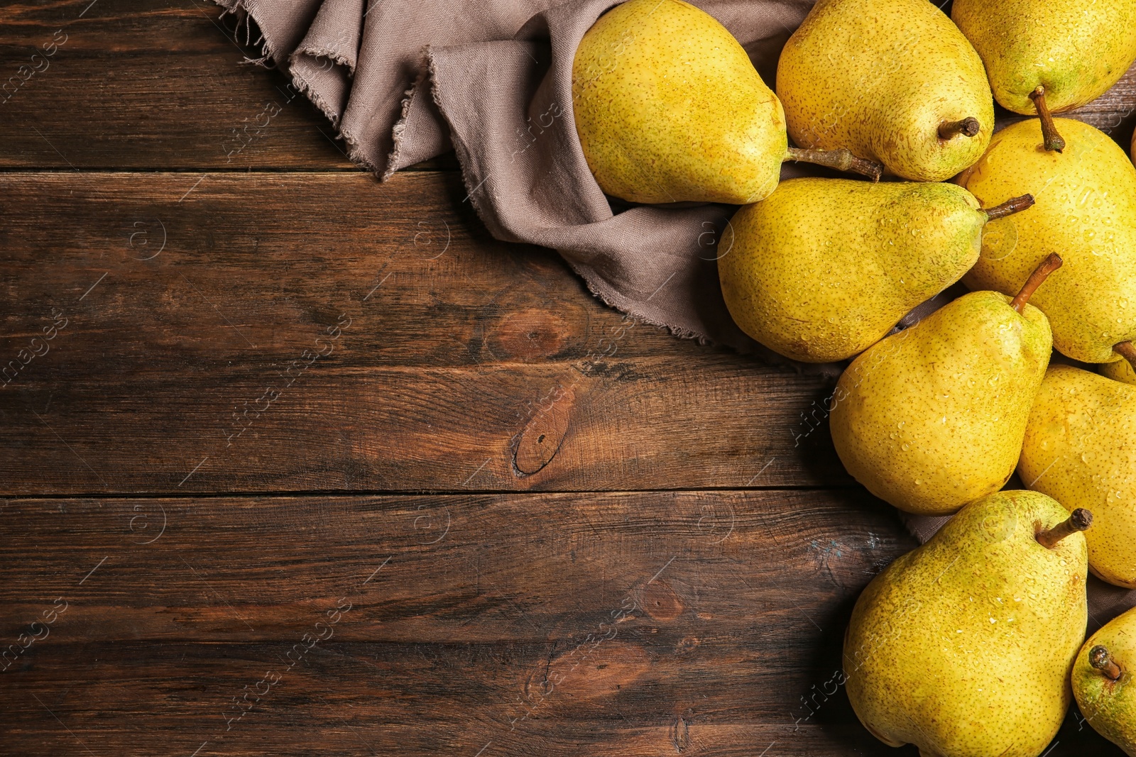 Photo of Flat lay composition with fresh ripe pears and space for text on wooden background