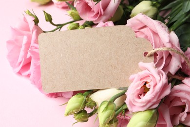 Happy Mother's Day. Beautiful flowers and blank card on pink background, closeup