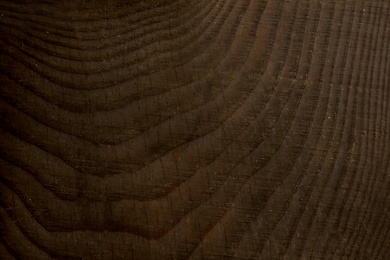 Photo of Texture of dark wooden surface as background, closeup view