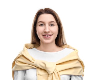 Portrait of smiling woman with dental braces on white background