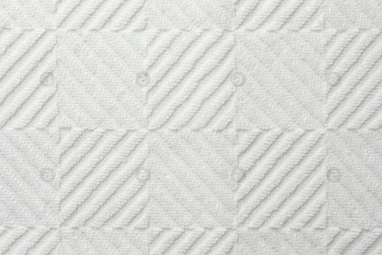 Photo of Texture of white fabric as background, top view