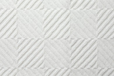 Photo of Texture of white fabric as background, top view