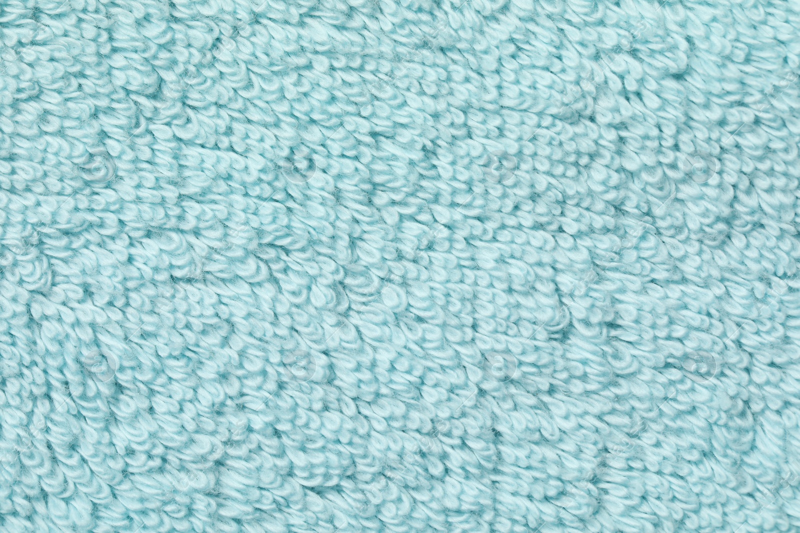 Photo of Texture of soft light blue fabric as background, top view