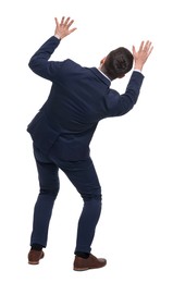 Businessman in suit on white background, back view