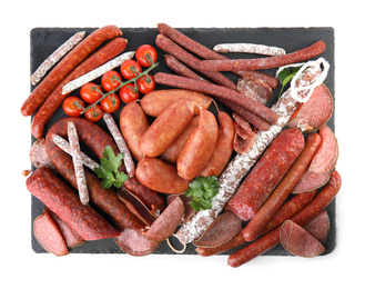 Photo of Slate plate with different tasty sausages isolated on white, top view