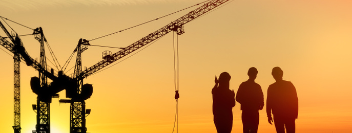 Image of Silhouettes of engineers near construction site at sunrise. Banner design