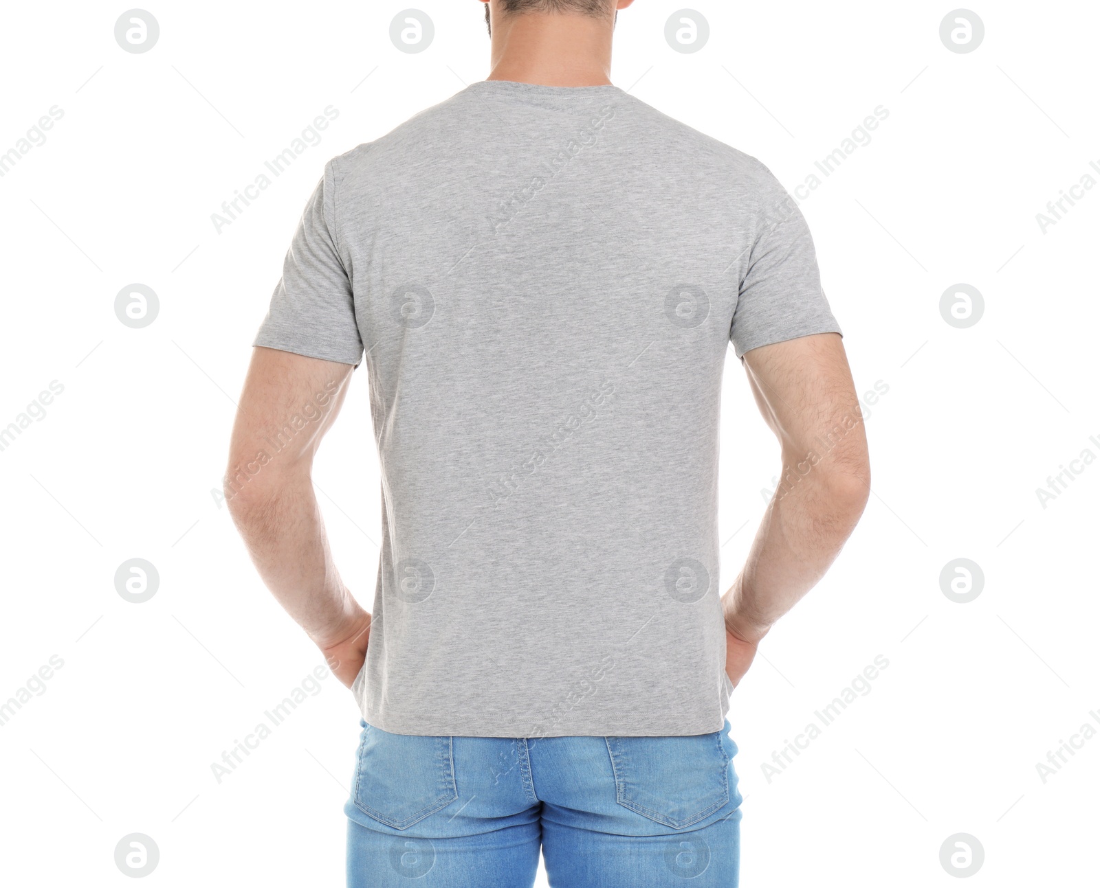 Photo of Young man in t-shirt on white background. Mockup for design