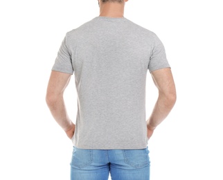 Photo of Young man in t-shirt on white background. Mockup for design