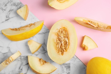 Photo of Flat lay composition with cut melon on color background