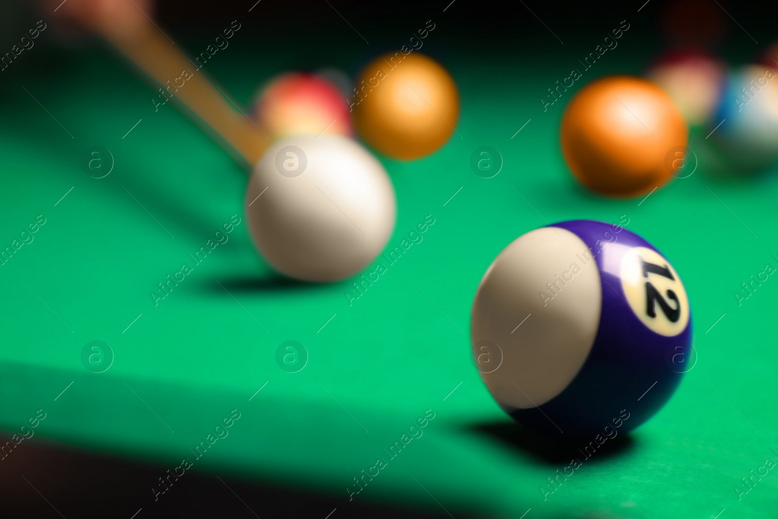 Photo of Many colorful billiard balls on green table, closeup. Space for text